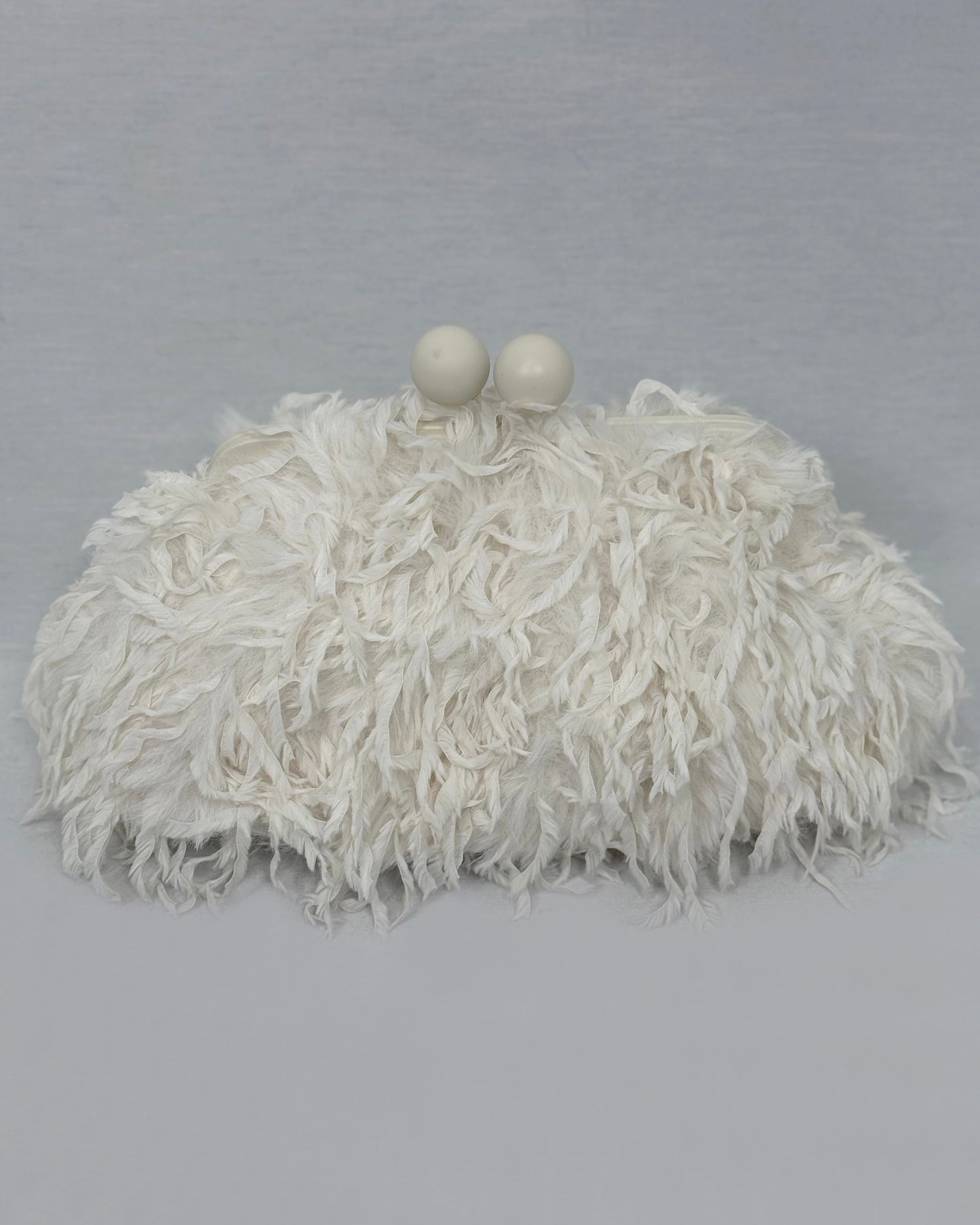 CLUTCH PLUMAS BLANCO